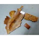 A collection of burr wood to include a leaf shaped dish and two boxes, largest 50cm long