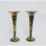 A pair of Edwardian Walker & Hall silver Solifleur vases with hammered finish and circular foot,