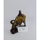 A carved soapstone figure of a Buffalo with a boy rider, 15 x 14cm