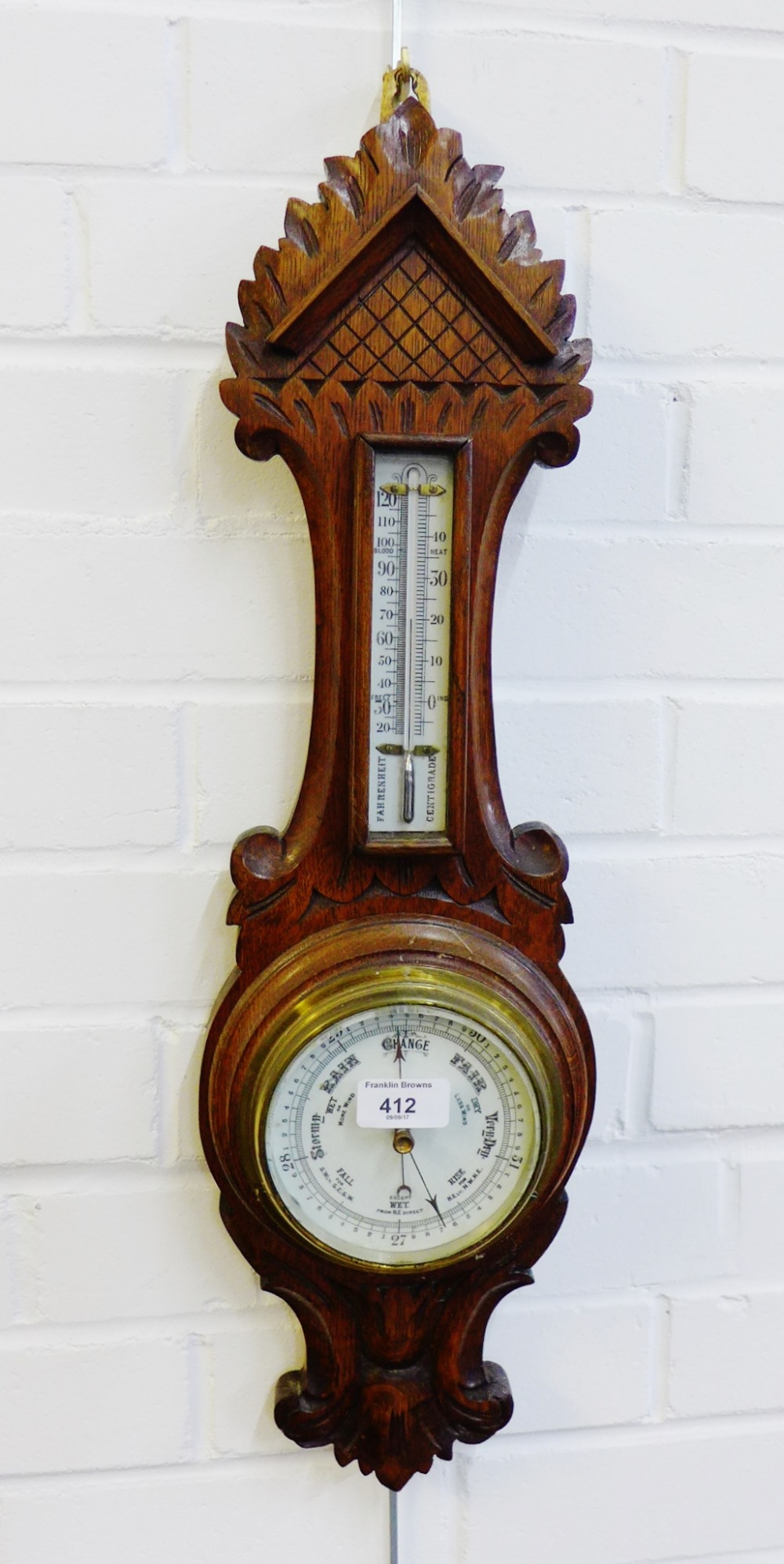 An oak cased wall barometer