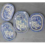 A collection of four Staffordshire blue and white 'Willow' patterned ashets, largest 55 x 40cm, (4)