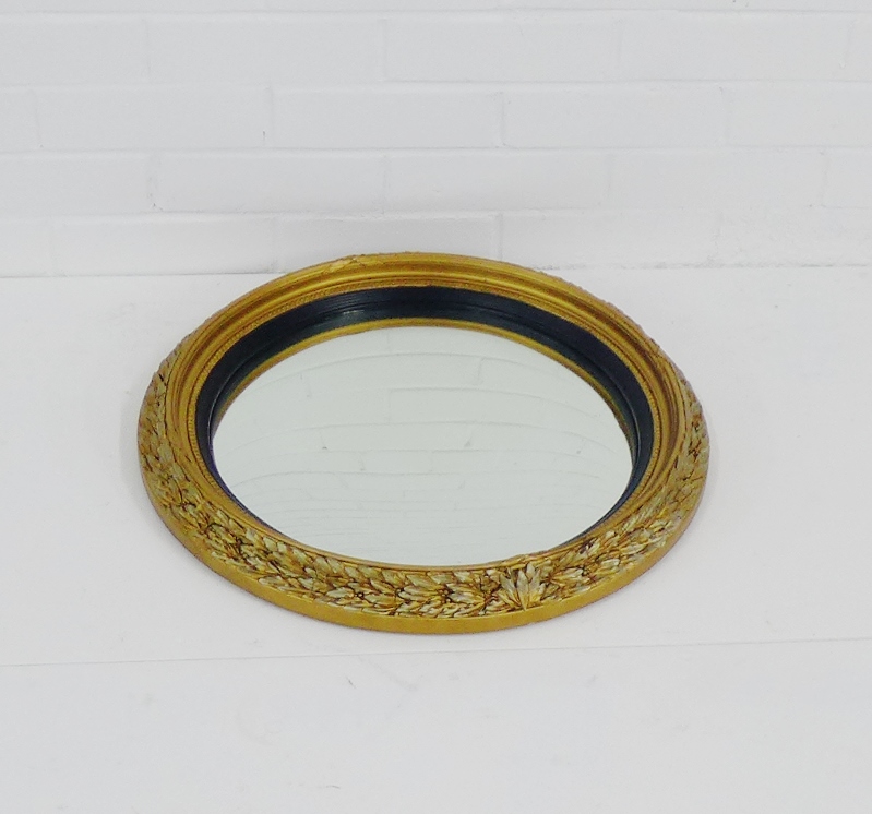 A contemporary convex wall mirror, diameter 54cm