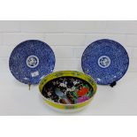 A pair of Japanese blue and white plates, together with a parrot and prunus patterned fruit bowl (3)