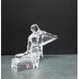 An Orrefors glass curling figure, 12cm high