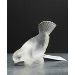 A Lalique opaque glass bird figure with etched mark 'Lalique France' to base, 10cm high