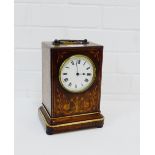 A French rosewood and inlaid mantle clock, the enamel dial with Roman numerals with a brass carry