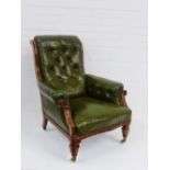 A walnut framed green leather button back armchair, 94 x 74cm