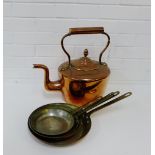 A large copper kettle, together with a set of four graduated copper and brass cooking pans, (5)