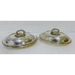 A pair of Epns entree dishes with covers, each with a cast fruit and vine leaf handle and engraved