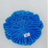 A Minton blue glazed butterfly moulded plate with impressed backstamp and number 1545, 25cm wide