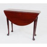 An 18th century red walnut drop leaf table of small proportions, raised on tapering supports and