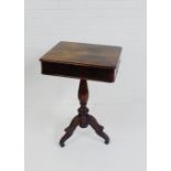 A Biedermeier rosewood and grain painted work table, with star motif to centre, raised on tripod