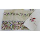 An early 20th century embroidered table cloth, together with an embroidered pillow case, (2)