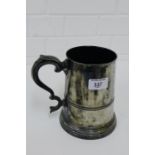 A large pewter quart tankard with engraved Stag's head pattern