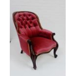 A mahogany show frame button back armchair, upholstered in red velvet fabric, 88 x 64cm