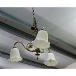 An Art Nouveau three branch light fitting with white opaque glass shades
