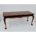 A burr wood coffee table on leaf carved cabriole legs and terminating in claw and ball feet, 52 x