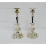 A pair of silver plated telescopic candlesticks with foliate knop stems and circular bases and
