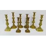 Four pairs of knop stemmed brass candlesticks, (8)