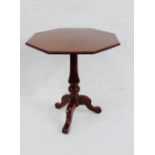 A mahogany table with hexagonal top and tripod support, 70 x 62cm