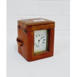 A small brass carriage clock complete with leather outer carrying case, 13cm high