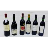 A collection of seven bottles of red wine to include Cabernet Sauvignon, Chateau de Quarante, and