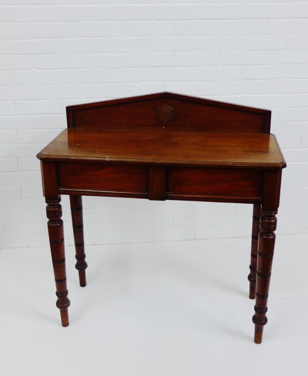 A mahogany ledgeback side table on turned tapering supports, 95 x 90cm