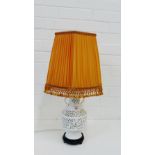 A white glazed ceramic table lamp base of reticulated baluster form with twin handles, complete with