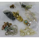 A collection of vintage costume jewellery to include earrings, brooches and buckles etc (a lot)