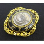 A Victorian black enamel hair locket mourning brooch, 7cm wide