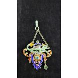 A gemset and enamel pendant with suspension loop 3.5cm wide