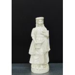 19th century salt glazed figure of a female modelled standing with a basket of fruit and a bird in