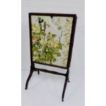 A mahogany fire screen with fabric insert 106 x 56cm