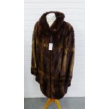 A brown fur three quarter length coat with a Jan Hamilton, Rodney Street Edinburgh Furrier label