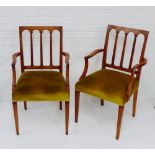 A pair of open armchairs with upholstered seats and tapering supports, 92 x 55cm, (2)