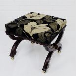 A mahogany x frame stool, with upholstered top and ceramic castors, 38 x 42cm