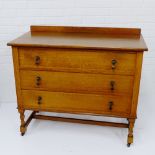 An oak ledgeback chest with three long drawers and barley twist supports, 86 x 98cm