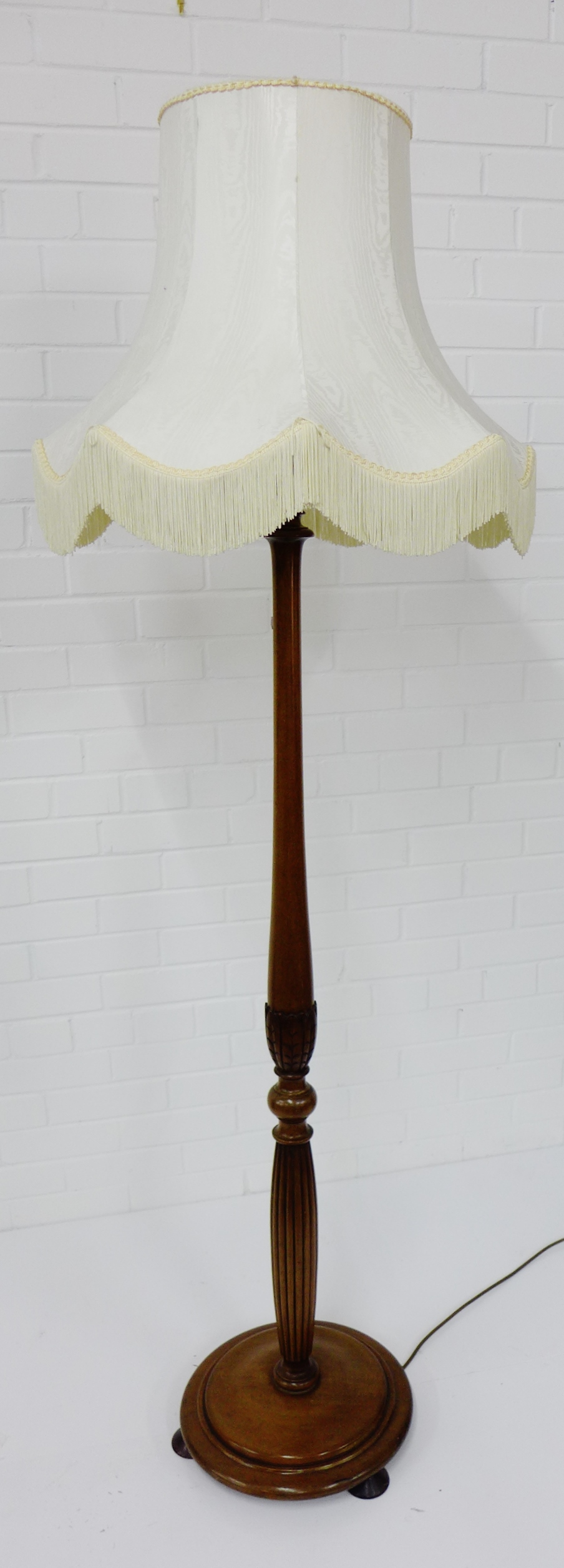 A mahogany standard lamp and shade, 180cm high