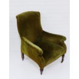 A green plush upholstered armchair, on mahogany supports and ceramic castors, 90 x 66cm