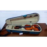 A violin, bow and fitted case