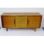 Dyrlund sideboard with six central drawers flanked by tambour doors, on block supports, 88 x 90cm