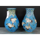 A pair of Satsuma 'Cranes' patterned vases with a turquoise blue cloud ground and foliate