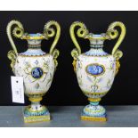 A pair of 19th century Cantagalli Majolica vases, each with loop handles to side and mask head