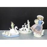 A Lladro porcelain figure of a 'Girl with basket of flowers', together with a Lladro figure of '