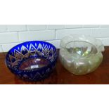 An opalescent glass bowl with frilled rim and lobbed circular outline, together with a blue cut