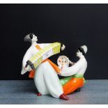 A Russian porcelain figure of an accordion player and tambourine player, 18cm high