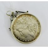 An 1881 USA One Dollar coin in a silver mount