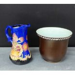 A Moorcroft style jug, 15cm, together with a stoneware brown glazed pot, (2)