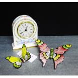 A Wedgwood 'Ribbon Cascade' patterned porcelain mantle clock, together with two Portuguese painted