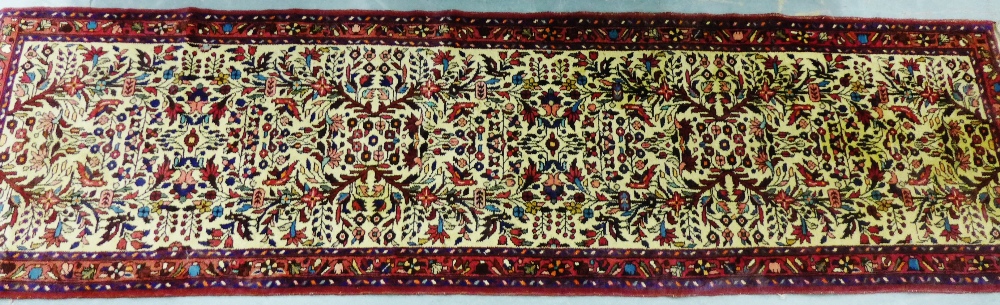 An Eastern runner, the beige filed with all over foliate pattern, 80 x 305cm